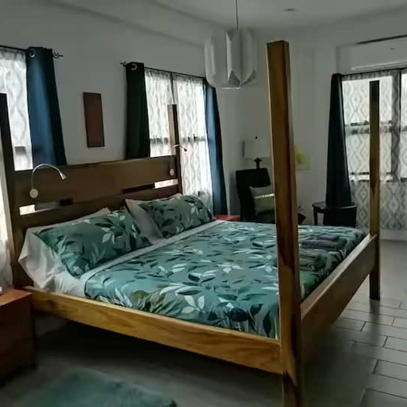 master bedroom with a king sized bed.