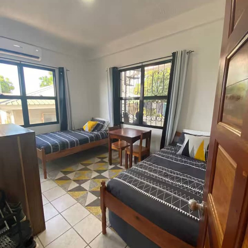 a bedroom with 2 single beds