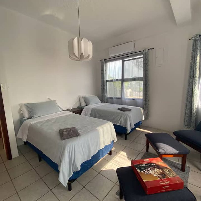 a bedroom with 2 single beds