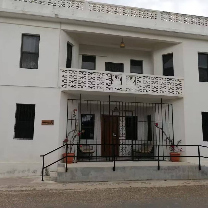 Front of 14 cedar, gated fence doors and locks